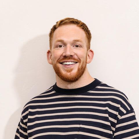 A headshot of Dom Maskell